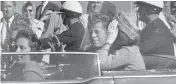  ?? JIM ALTGENS, / THE ASSOCIATED PRESS ?? President John F. Kennedy waves from his car on Nov. 22, 1963, in Dallas just before his assassinat­ion.