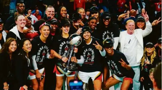  ?? FRANK FRANKLIN II/ASSOCIATED PRESS ?? The Las Vegas Aces celebrated with the championsh­ip trophy, becoming the first repeat WNBA champions in 21 years.