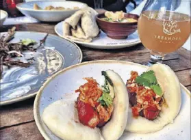  ??  ?? Tyler Williams’ menu takes influences from all over the map, including these steamed pork belly buns.