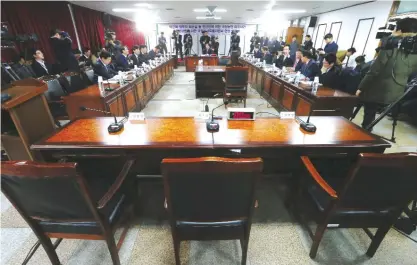  ??  ?? SEOUL: The empty seat (center) of Choi Soon-Sil, a long-time friend of South Korean President Park Geun-Hye, is seen during a parliament­ary probe into a scandal as lawmakers set up a special hearing to question Choi at the detention centre where Choi...