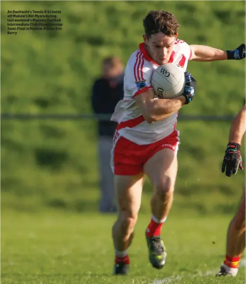  ??  ?? An Gaeltacht’s Tomás Ó Sé holds off Mallow’s Bill Myers during last weekend’s Munster Football Intermedia­te Club Championsh­ip Semi-Final in Mallow. Photo: Eric Barry
