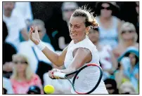  ?? AP/KIRSTY WIGGLESWOR­TH ?? Petra Kvitova lost to American Madison Brengle in the second round at Wimbledon on Wednesday. A two-time Wimbledon champion, Kvitova was competing in her third tournament since she was attacked by an intruder at her home in the Czech Republic in...