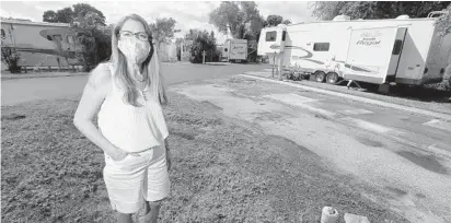  ?? AMY BETH BENNETT/SOUTH FLORIDA SUN SENTINEL ?? Manager Nancy Schreiber is shown on Oct. 29 at one of the few empty spaces at Paradise Island RV Resort in Oakland Park. Schreiber said they’ve had a busier than usual summer season and heading into winter season she’s seeing shorter than usual bookings.