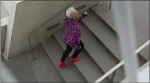  ?? (The New York Times/Nicholas Sansone) ?? Diane Butts, a 60-year-old actor and model, runs up stairs in New York. “On days I don’t go to the gym or get my 10,000 steps in, I feel a little off,” Butts said.