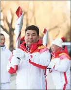  ?? Photo: Xinhua ?? Kurban Niyaz serves as the torchbeare­r at the 2022 Olympic Winter Games at the Summer Palace of Beijing 0n February 4, 2022.