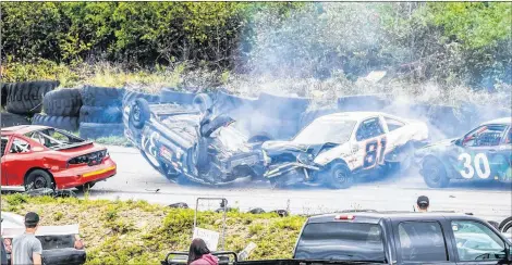  ??  ?? A racecar driven by Freeman d’Entremont ended upside-down on Aug. 19 at the Lake Doucette Motor Speedway.