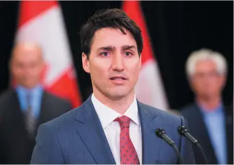  ??  ?? Justin Trudeau n’a pas fini d’essuyer les critiques concernant ses vacances sur l’île de l’Aga Khan. - La Presse canadienne: Nathan Denette