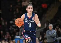  ?? Terrance Williams/Associated Press ?? UConn forward Lou Lopez Senechal brings the ball upcourt against Georgetown on Feb. 11 in Washington.