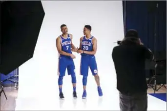  ?? MATT ROURKE — THE ASSOCIATED PRESS ?? Two members of the 76ers’ young core — Timothe Luwawu-Cabarrot, left, and Markelle Fultz — joke around Monday as they pose for a photograph during media day at the team’s practice facility in Camden.