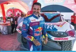  ?? ?? AL-ULA: Prodrive’s Qatari driver Nasser Al-Attiyah walks past his car during a checkup in the bivouac ahead of the Dakar rally 2024 in Al-Ula, Saudi Arabia, on January 3, 2024. — AFP