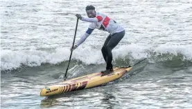  ??  ?? Sinda Thakathani says he does most of his training in the sea as it requires more balance and increases his fitness by having to paddle through the waves. Photo: Brenton Geach