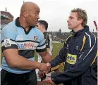  ??  ?? Jonah Lomu, left, and Justin Marshall after a match between Cardiff and Leeds in 2006.