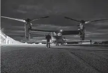  ?? Lance Cpl. Elias E. Pimentel III / U.S. Marine Corps ?? U.S. Marines inspect a MV-22B Osprey on Wednesday before a flight during the Cold Response exercise in Norway.