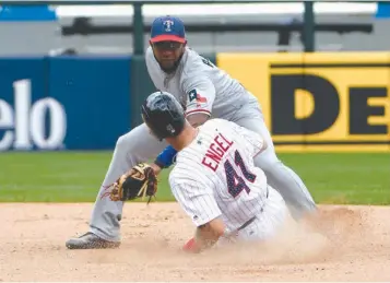  ?? Associated Press ?? Chicago White Sox's Adam Engel (41) is tagged out on a steal-attempt of second base by Texas Rangers shortstop Elvis Andrus during the seventh inning of a baseball game Sunday in Chicago.