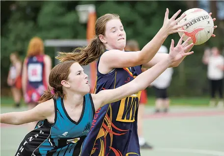  ??  ?? Battling for possession of the ball are Yarragon’s Jessica Wilms (left) and Longwarry’s Chevie Davis.