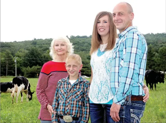  ?? PHOTOS BY LYNN KUTTER ENTERPRISE-LEADER ?? Washington County Farm Family of the Year is the Weavers: (from right) Michael Weaver and his wife, Kristi, son Levi, 10, and Michael’s mother, Rita Weaver. Their farm is called Weaver Dairy and it is located on 100 acres in the Hogeye community.