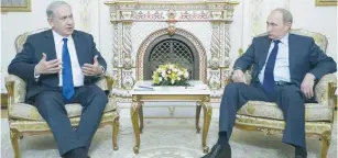  ??  ?? PRIME MINISTER Benjamin Netanyahu speaks with Russian President Vladimir Putin during their meeting at the Novo-Ogaryovo state residence near Moscow last September.