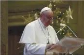  ?? VATICAN MEDIA VIA AP ?? Pope Francis delivers a Christmas Day message from a hall inside the Apostolic Palace of the Vatican on Friday.