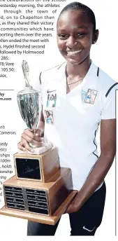  ?? robert.bailey @gleanerjm.com ?? Edwin Allen’s Kasheika Cameron, the ISSA/ GraceKenne­dy Girls’ Athletics Championsh­ips Class One 100m champion, holds the championsh­ip trophy during the school’s celebratio­ns inFrankfie­ld, Clarendon, yesterday.