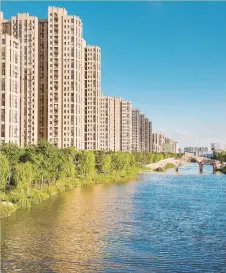  ??  ?? Residentia­l houses built along clean waterways are witnesses of the improvemen­ts in residents’ living conditions in Nanxiang Town.