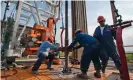  ?? Photograph: Eddie Seal/ Bloomberg/Getty Images ?? Workers wrestle with a pipe on a Texas oil rig, but their efforts may not be enough to supply Europe.