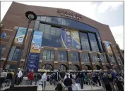  ?? AMY SANCETTA — THE ASSOCIATED PRESS FILE ?? Fans arrive at Lucas Oil Stadium before a men’s NCAA Final Four semifinal college basketball game between Butler and Michigan State in Indianapol­is on April 3, 2010.