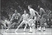  ?? HF — THE ASSOCIATED PRESS FILE ?? Boston’s Sam Jones, left, drives past the Lakers’ Jerry West (44) and drives along the baseline towards the basket in the teams’ NBA playoff game in Los Angeles on May 2, 1968. At right are Darrall Imhoff of Lakers, who blocked the shot, and Celtics’ Bill Russell. Basketball Hall of Famer Jones, the skilled scorer whose 10 NBA titles is second only to teammate Bill Russell, died on Thursday, Dec. 30, 2021, the team said. He was 88.