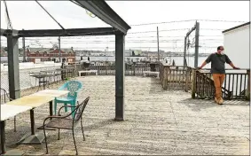  ?? DANA JENSEN/THE DAY ?? Sal D’Angelo, the new owner of the former Brass Rail, stands on the large deck and talks Wednesday about his plans for a restaurant in New London.