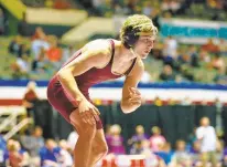  ?? JOHN SUDBRINK/FOR THE DAILY PRESS ?? Poquoson 120-pounder Cole McCormick gets ready to wrestle Powhatan’s Joseph McMillin during the 39th annual Virginia Duals in Hampton.