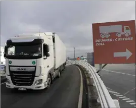  ?? LEWIS JOLY / AP ?? A truck arrives to board the first ferry heading to Britain after Brexit on Friday in Calais, northern France. Britain left the European bloc’s vast single market for people, goods and services Thursday at 11 p.m. London time, midnight in Brussels, completing the biggest single economic change the country has experience­d since World War II.