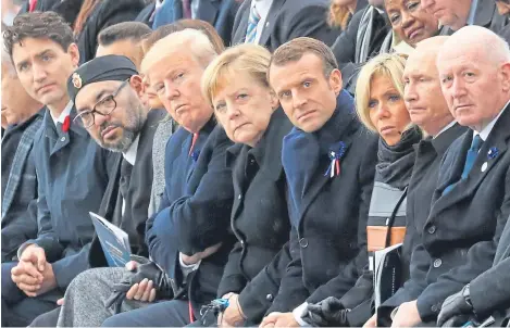  ?? Picture: AP. ?? From left: Canadian Prime Minister Justin Trudeau, Morocco’s Prince Moulay Hassan, Moroccan King Mohammed VI, US First Lady Melania Trump, US President Donald Trump, German Chancellor Angela Merkel, French President Emmanuel Macron and his wife Brigitte Macron, Russian President Vladimir Putin and Australian Governor-General Peter Cosgrove attend a ceremony at the Arc de Triomphe in Paris.