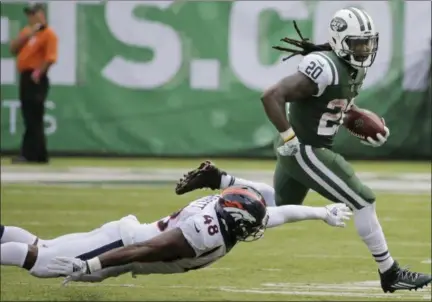  ?? SETH WENIG - THE ASSOCIATED PRESS ?? New York Jets’ Isaiah Crowell (20) runs away from Denver Broncos’ Shaquil Barrett (48) during the second half of an NFL football game Sunday, Oct. 7, 2018, in East Rutherford, N.J.