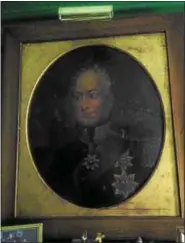  ??  ?? This is a rare oil painting of King George III of England wearing his English Monarch medallions.