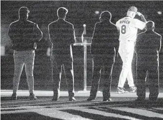  ?? DOUG KAPUSTIN/BALTIMORE SUN ?? Backed by Hall of Famers, from left, Eddie Murray, Jim Palmer, Frank Robinson and Earl Weaver, Orioles great Cal Ripken Jr. walks off the field after he delivers a short goodbye speech following his last game in 2001.