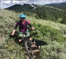  ?? COURTESY MOLLY ABSOLON ?? Mountain biker Celeste Young takes a break along the Big Hole Crest Trail in Idaho this summer.