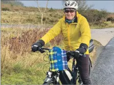  ??  ?? An Arran Belle takes her Doddie buff on a cycle to High Kildonan.