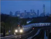  ?? MARK LENNIHAN — THE ASSOCIATED PRESS FILE ?? In this file photo, a No. 7 subway train rides the rails in the Queens borough of New York. If you’re a transporta­tion buff, New York City is the perfect destinatio­n.