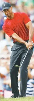  ??  ?? Tiger Woods plays a chip on the 15th hole during the final round of the Valspar Championsh­ip in Florida.