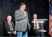  ??  ?? Mike Hanson, Democrat, speaks as P.D. Taylor, Republican, left, and Ed Grimes, independen­t, watch during a debate Wednesday of Oklahoma County sheriff’s candidates.