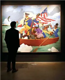  ?? ‘George Washington Carver Crossing the Delaware: Page from an American History Textbook’ by Robert Colescott is on display during Sotheby’s press preview of the upcoming Contempora­ry Art Evening Auction in New York City. ??