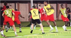  ?? (AFP) ?? Canada’s defender Cornelius Derek (second right) warms up with teammates during a practice session at Umm Salal SC training site ahead of the Qatar 2022 World Cup Group F match against Belgium.