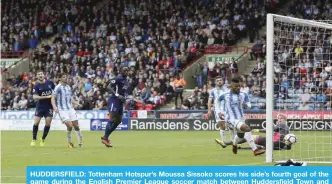  ?? — AP ?? HUDDERSFIE­LD: Tottenham Hotspur’s Moussa Sissoko scores his side’s fourth goal of the game during the English Premier League soccer match between Huddersfie­ld Town and Tottenham Hotspur at the John Smith’s Stadium, Huddersfie­ld, England, yesterday.