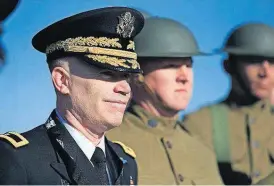  ?? [ORLIN WAGNER/AP PHOTO] ?? Brigadier General Patrick Frank stands for a photo with 1st Infantry Division color guard members dressed in WWI uniforms during ceremonies Thursday at the nation’s official WWI monument, Liberty Memorial, in Kansas City, Mo. Foreign dignitarie­s from...