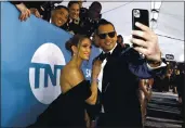 ?? MATT SAYLES— INVISION/AP, ?? Jennifer Lopez, left, Znd Alex Rodriguez tZke Z selfie Zs they Zrriue Zt the 2020 Screen Actors Guild AvZrds.