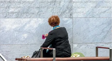  ?? PHOTO: STACY SQUIRES/FAIRFAX NZ ?? A woman looks at the new memorial wall during the commemorat­ions to mark the 6th anniversar­y of the Christchur­ch earthquake.