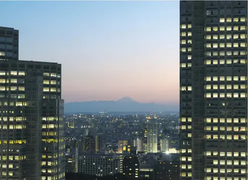  ?? — J.D. ANDREWS ?? Mount Fuji forms part of the skyline of Yokohama, Tokyo’s official port.