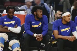  ?? ?? The Warriors' James Wiseman (33), center, sits on the bench in the first quarter against the Jazz at Chase Center in San Francisco on Dec. 28.