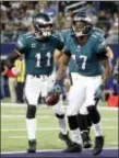  ?? (AP Photo/Michael Ainsworth) ?? Philadelph­ia Eagles’ Carson Wentz (11) celebrates after throwing a touchdown pass to Alshon Jeffery (17) in the second half of an NFL football game against the Dallas Cowboys on Sunday, Nov. 19, 2017, in Arlington, Texas.