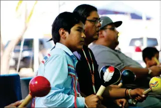  ??  ?? COCOPAH INDIAN TRIBE BIRD SINGERS PERFORM at the 2017 celebratio­n. A Cocopah Indian Tribe Bird Dancer demonstrat­es a traditiona­l dance at the 2017 celebratio­n (right).