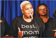  ?? AP PHOTO/BOB ANDRES ?? Georgia state Rep. Erica Thomas, D-Austell, speaks during a news conference in Atlanta on May 7. Thomas said she was verbally accosted in an Atlanta-area supermarke­t by a white man who told her to “go back where you came from.”